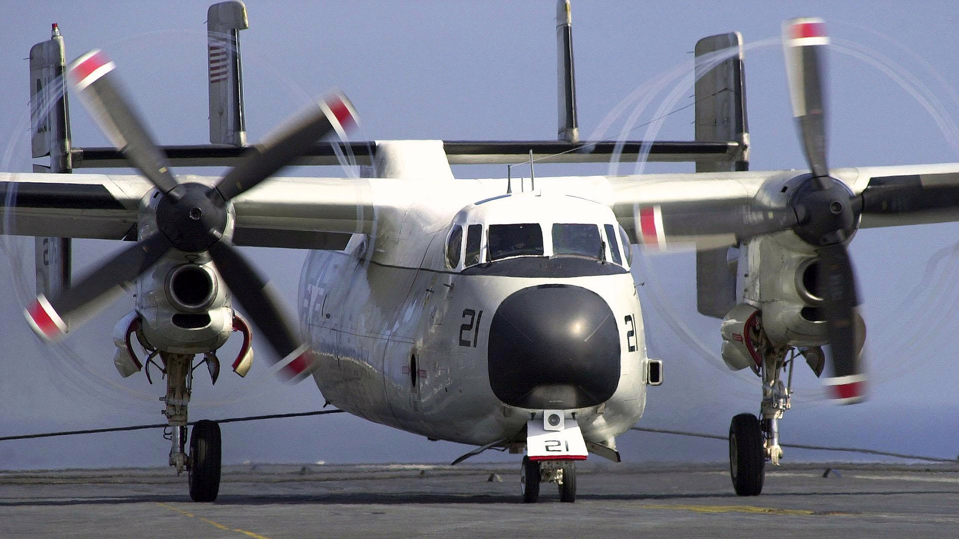 The C-2 Greyhound Quickly Stops on Aircraft Carriers While Transporting Jet Engines and Parts